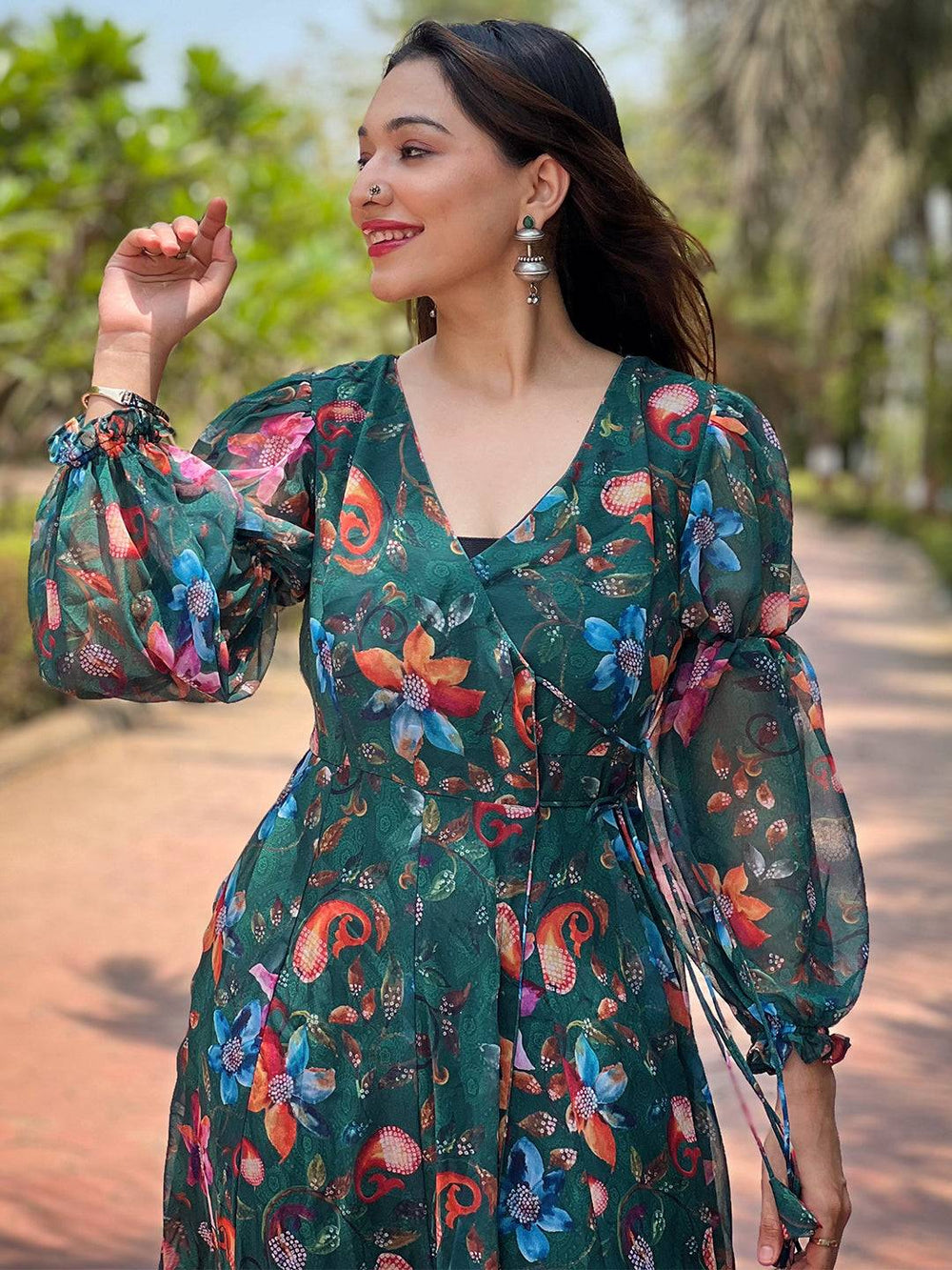 Woman wearing floral dark green angarakha dress