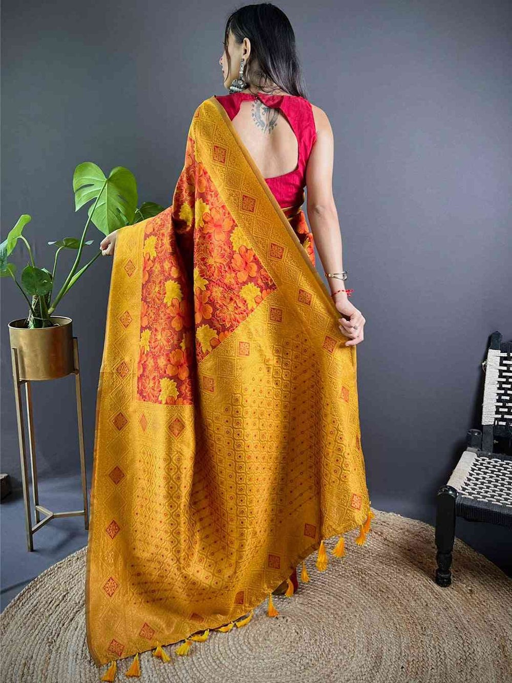 Back view of rust silk saree with intricate butta design