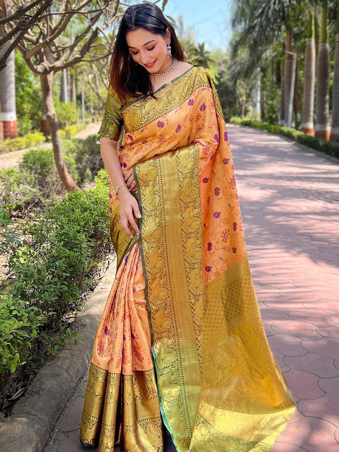 Elegant orange Banarasi saree featuring floral motifs