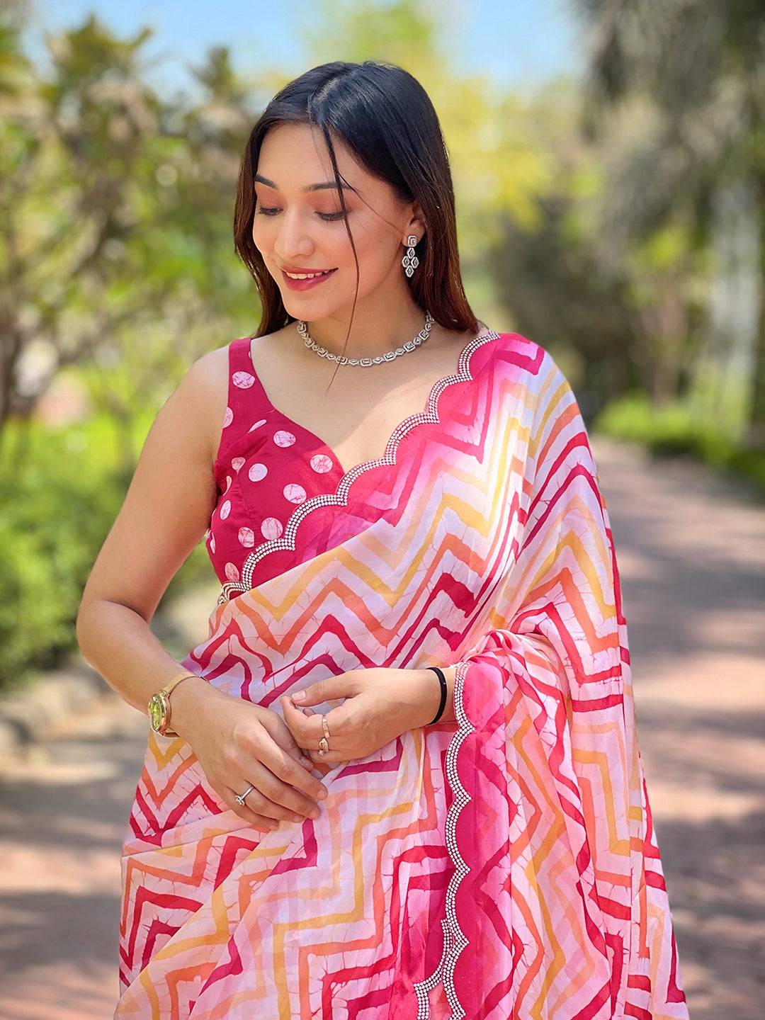 Model in Bollywood Leheriya striped saree, outdoor setting