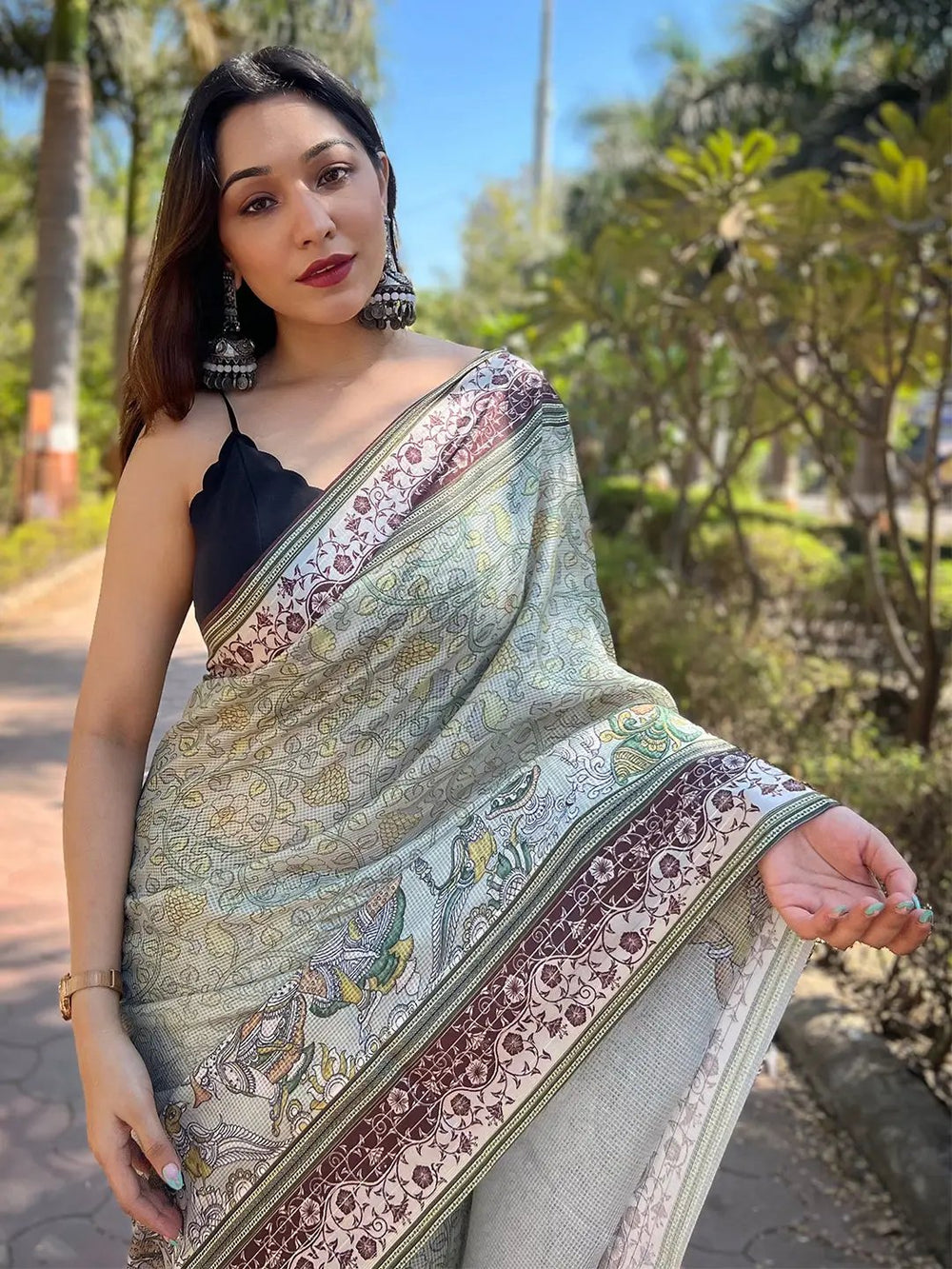 Close-up of Kalamkari print on Pista Satin Kota Doria Saree