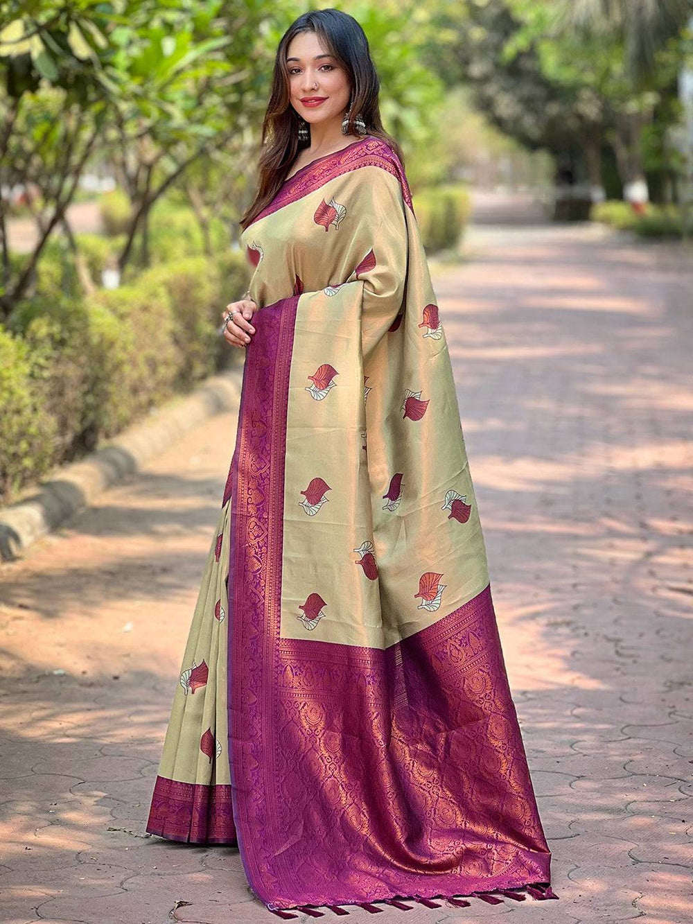 Elegant light green saree with maroon border and leaf patterns