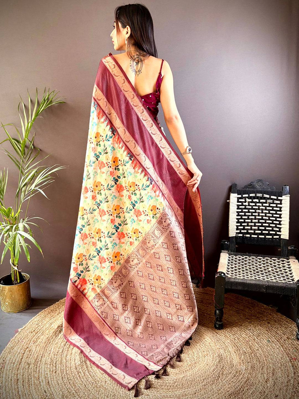 Back view of maroon Banarasi saree with floral and Zari details
