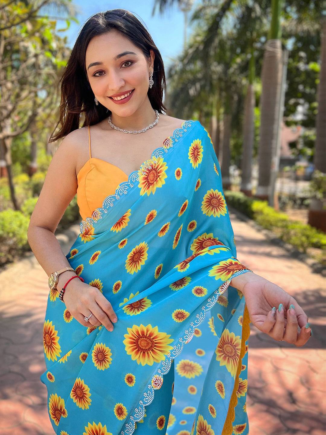 Blue saree with sunflower print and zircon Swarovski border