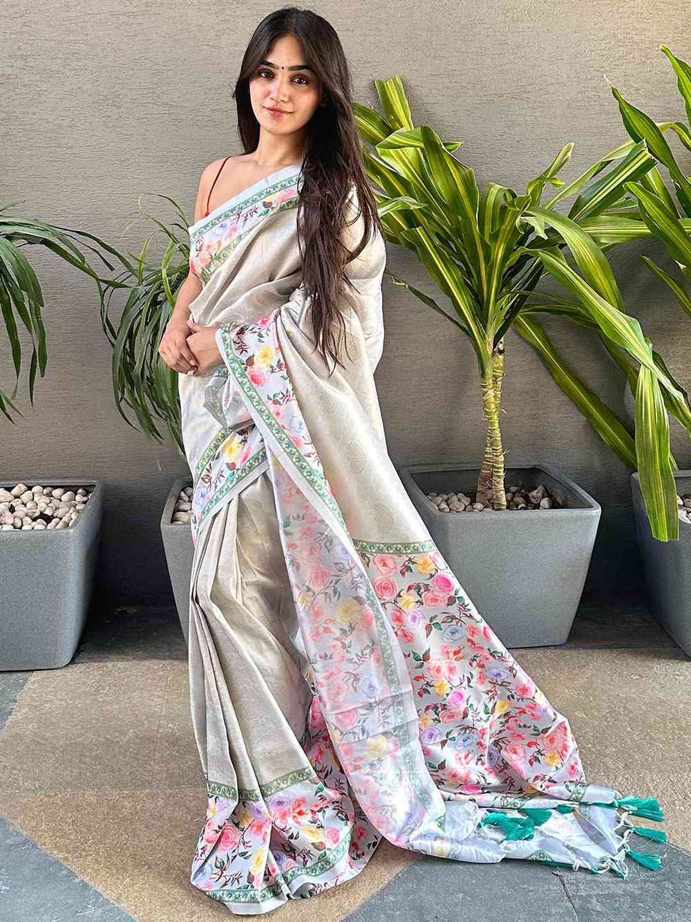 Stylish Kanjivaram saree with floral design worn by a model.