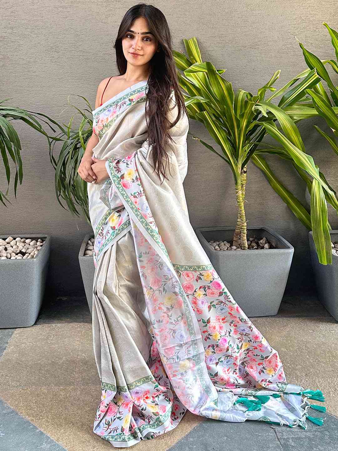 Stylish Kanjivaram saree with floral design worn by a model.