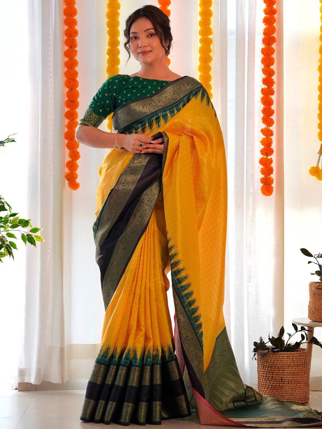 Yellow Banarasi silk Gadwal saree with green blouse, party wear.