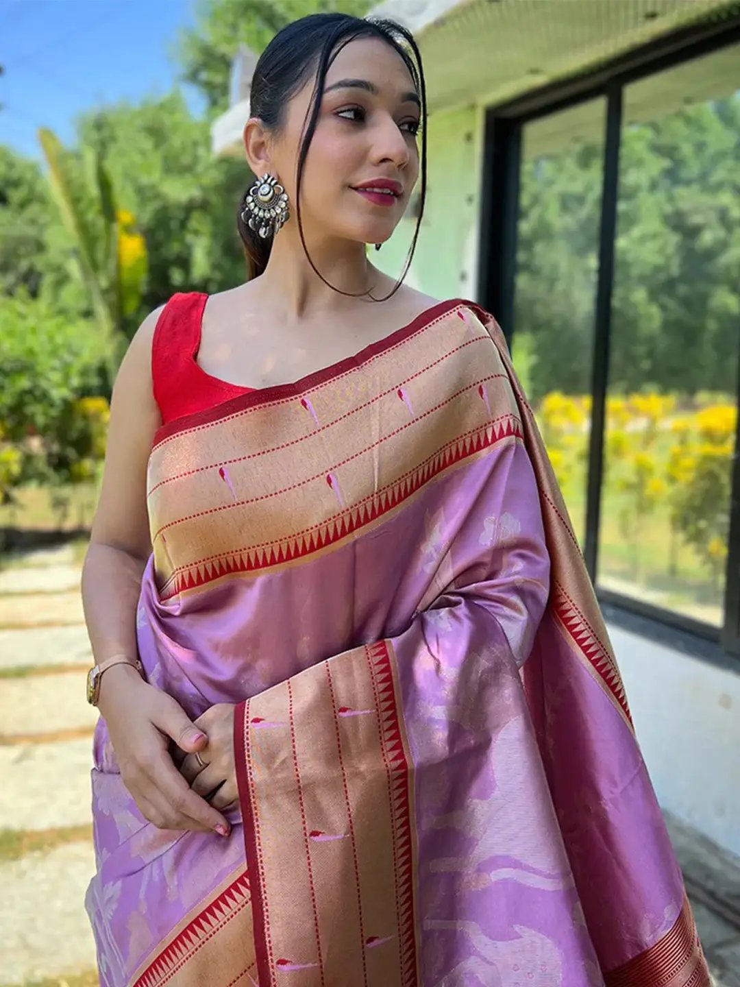 Lavender Paithani silk saree with red blouse, outdoor setting