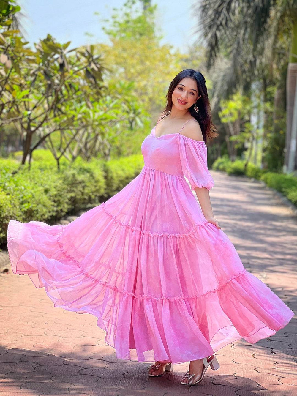 Elegant rose pink dress with floral print and tiered skirt