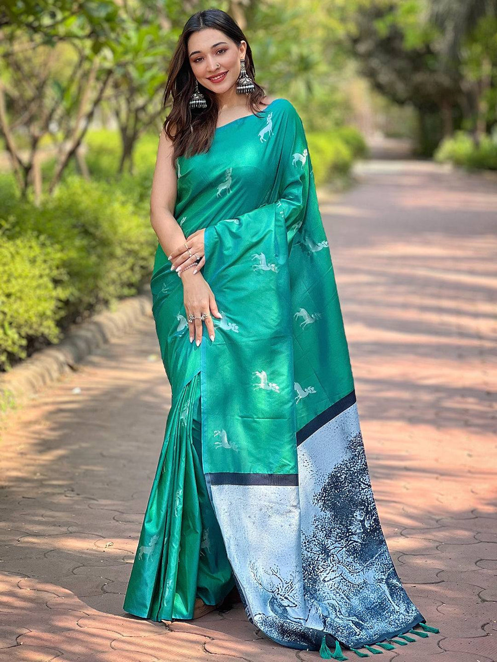 Full view of green silk saree with intricate zari pallu design