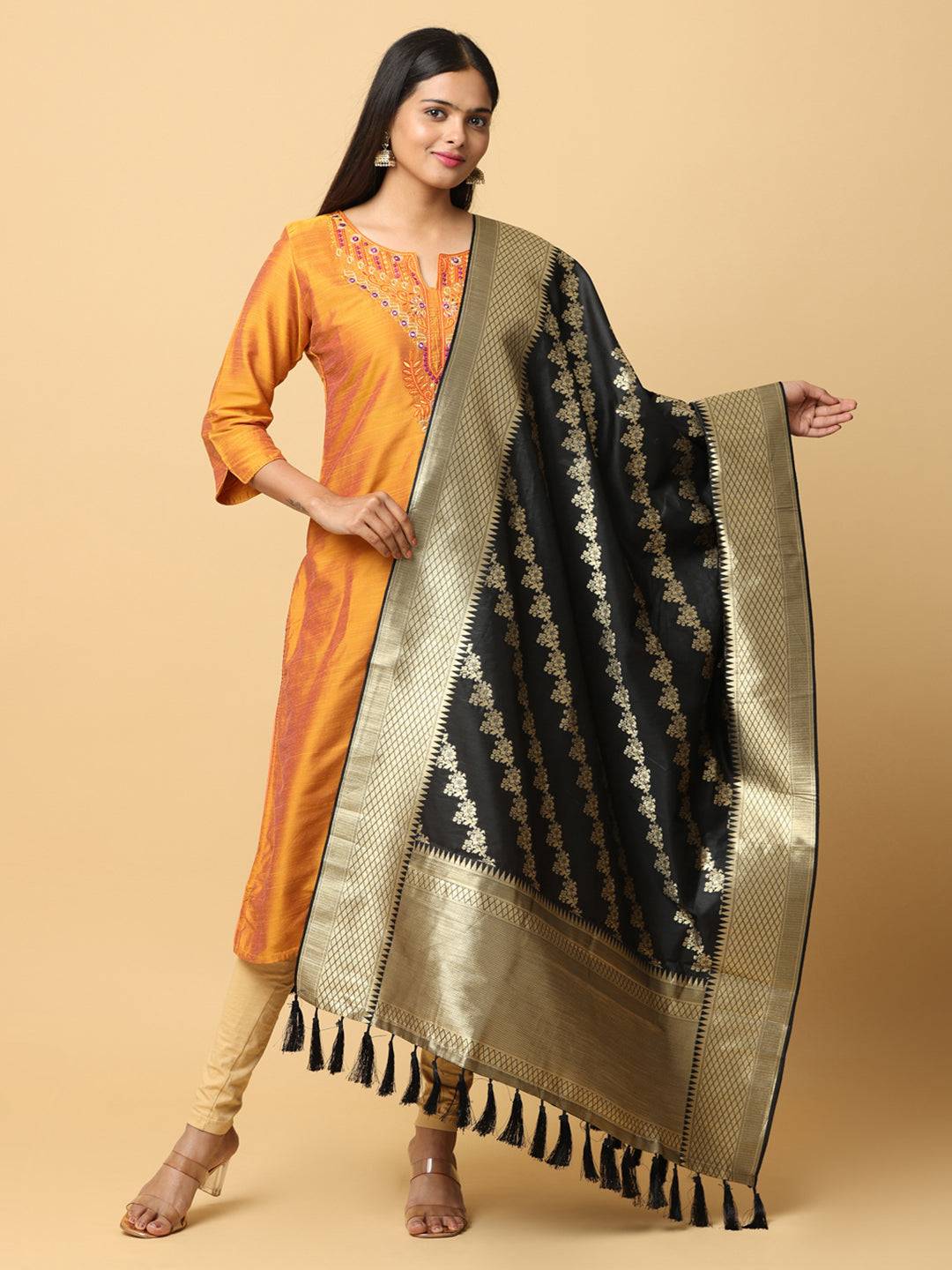 Black woven design dupatta with resham tassels.