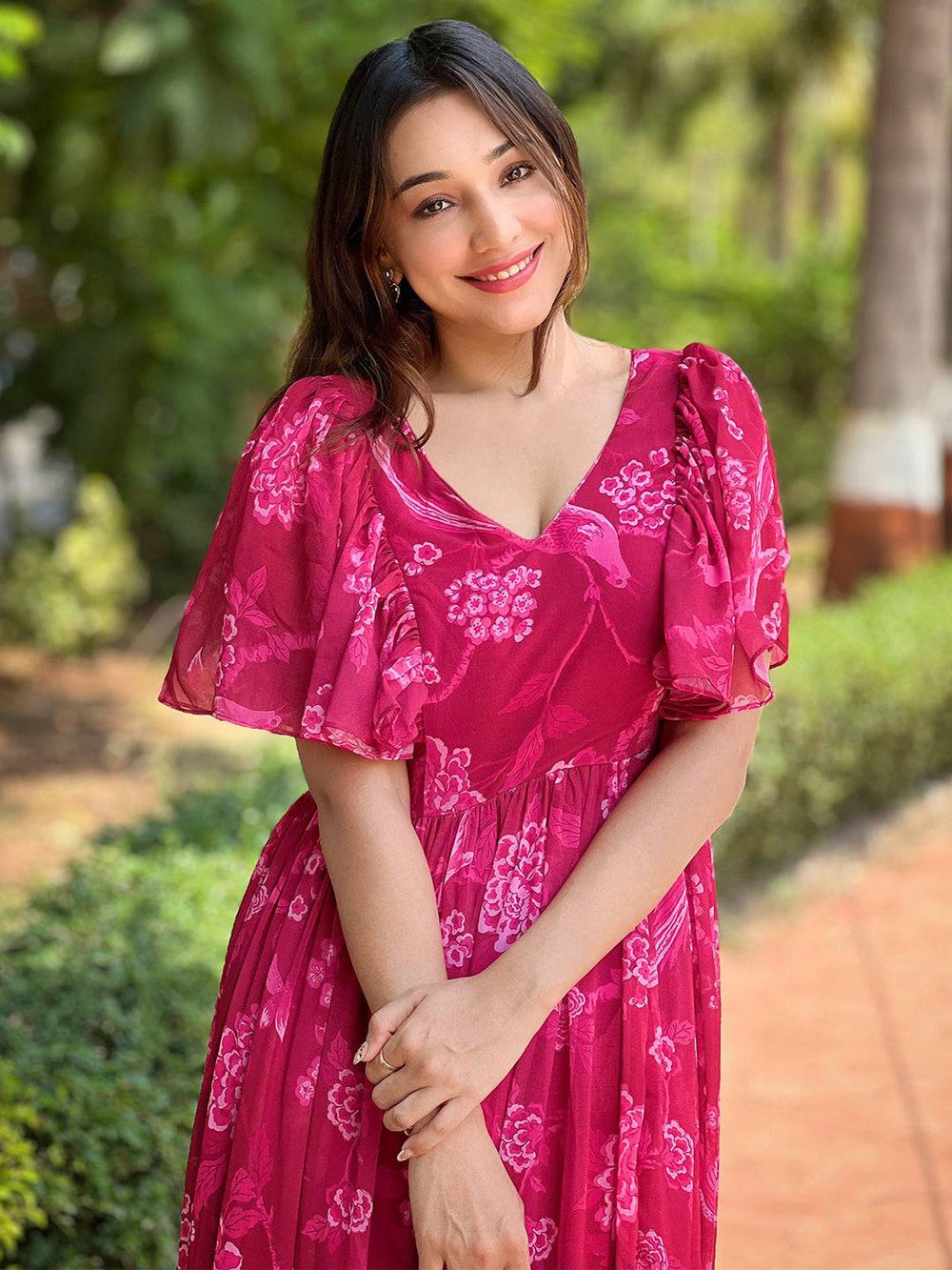 Smiling woman in Pink Peony V-neck Flary Dress