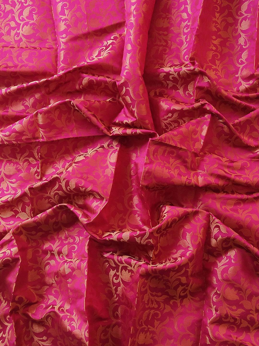 Rich brocade zari fabric in vibrant pink and gold