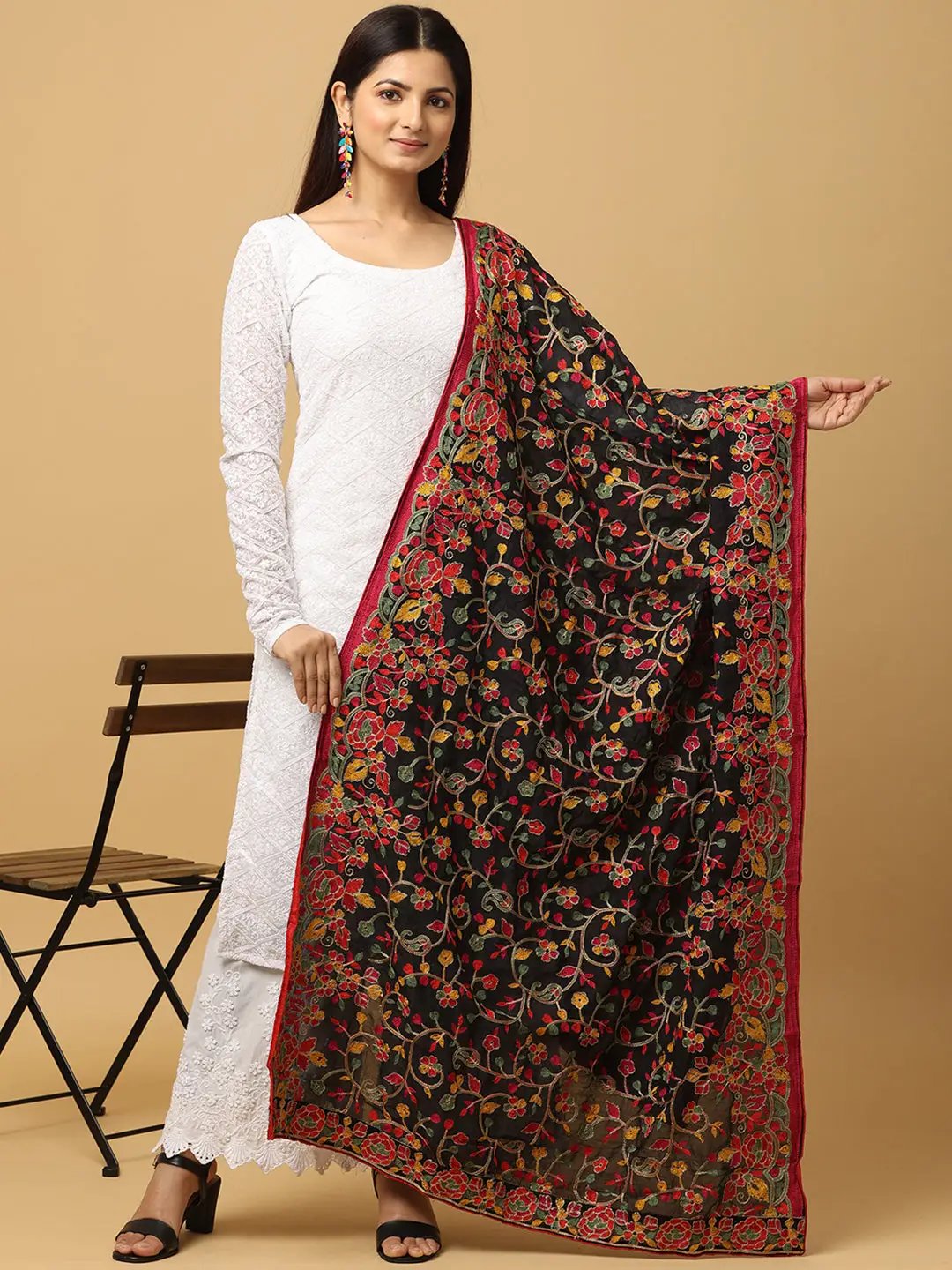Black poly chiffon dupatta with vibrant threadwork, worn over white outfit.