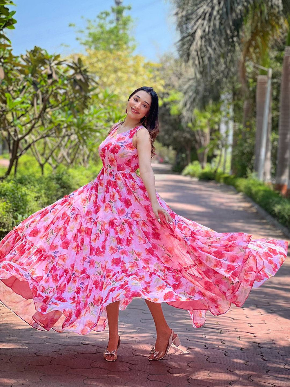 Flowing neon pink floral dress outdoors