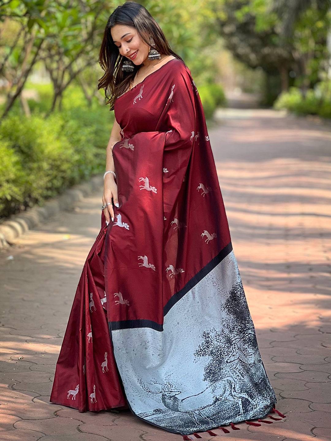 Full view of maroon soft silk saree with intricate zari pallu