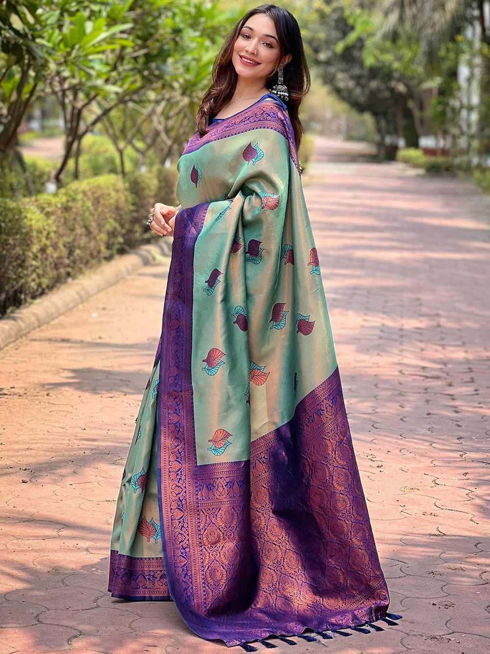 Side view of pista Kanjivaram saree with elegant gold zari work.