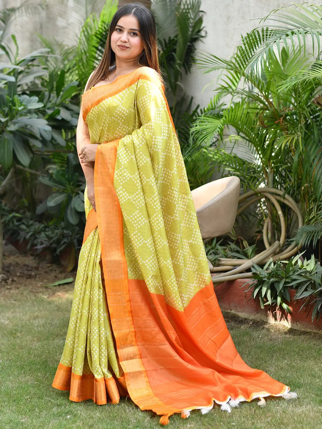 Traditional lime Bandhej saree, orange Kanjivaaram border