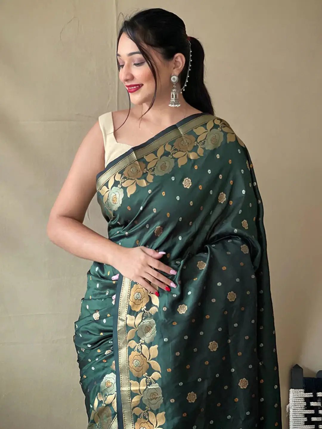 Bottle green Banarasi silk saree with zari woven floral design