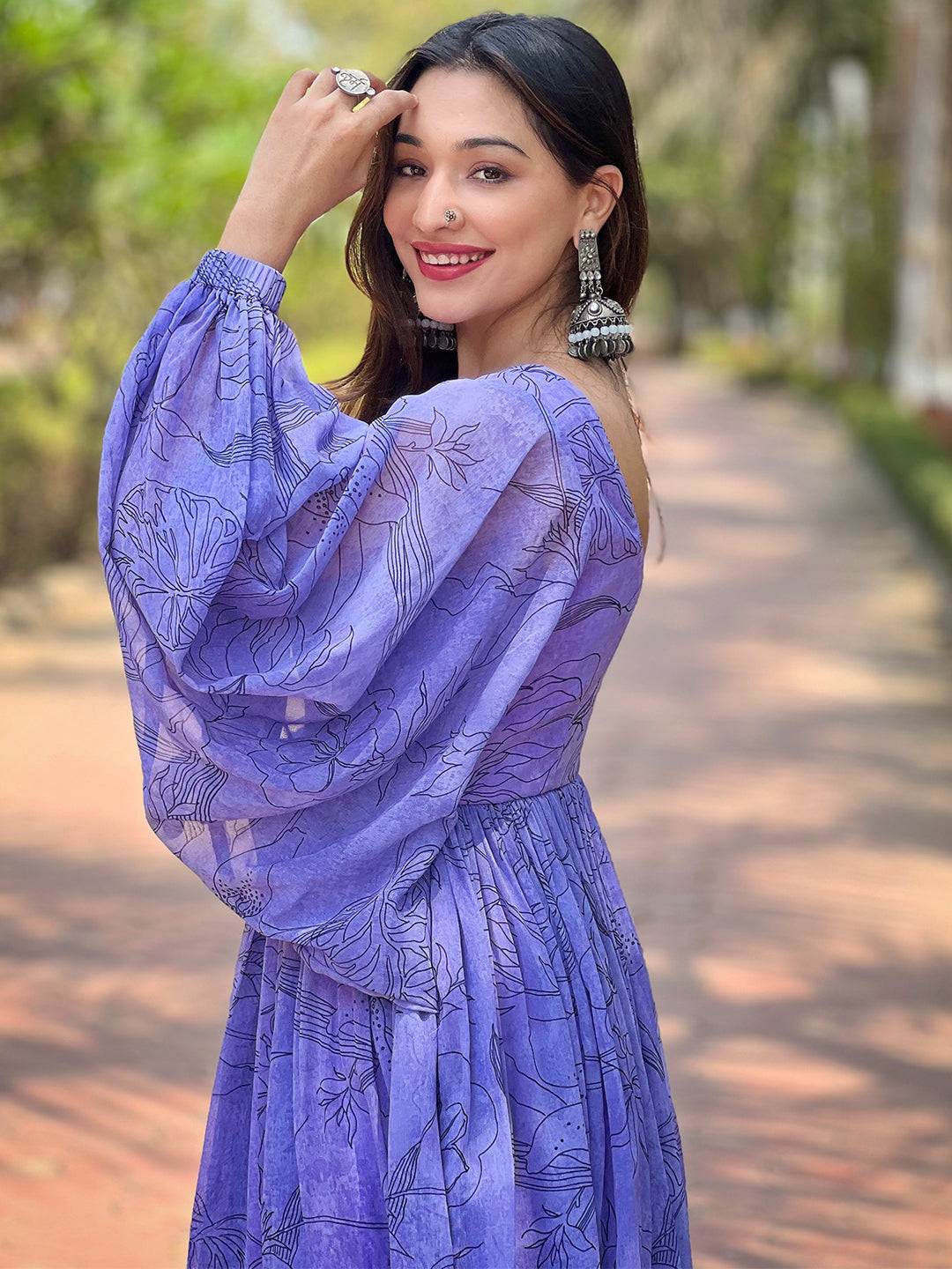 Side view of slate blue dress with puff sleeves