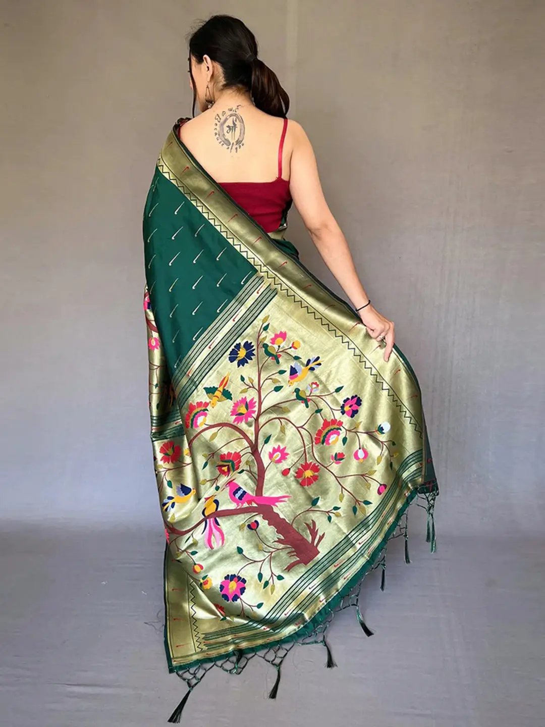 Back view of Bottle Green Paithani saree with intricate zari border