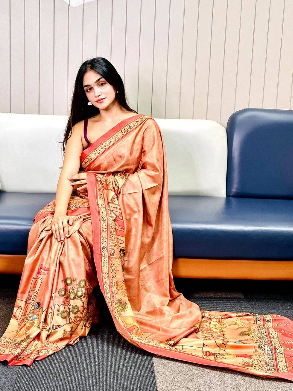 Muvel Free Hand Kalamkari Print Saree on sofa