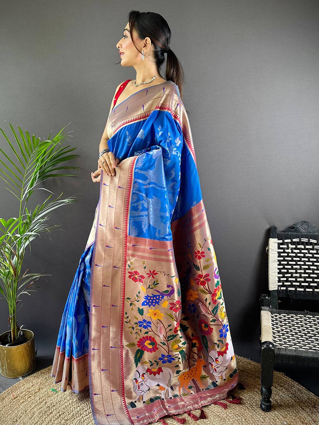 Elegant Royal Blue Paithani Silk Saree featuring vibrant Pichwai motifs.