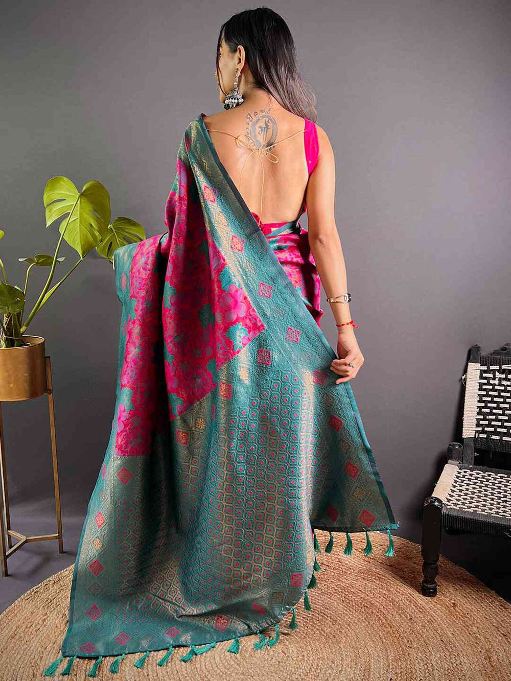 Back view of deep pink silk saree with floral patterns