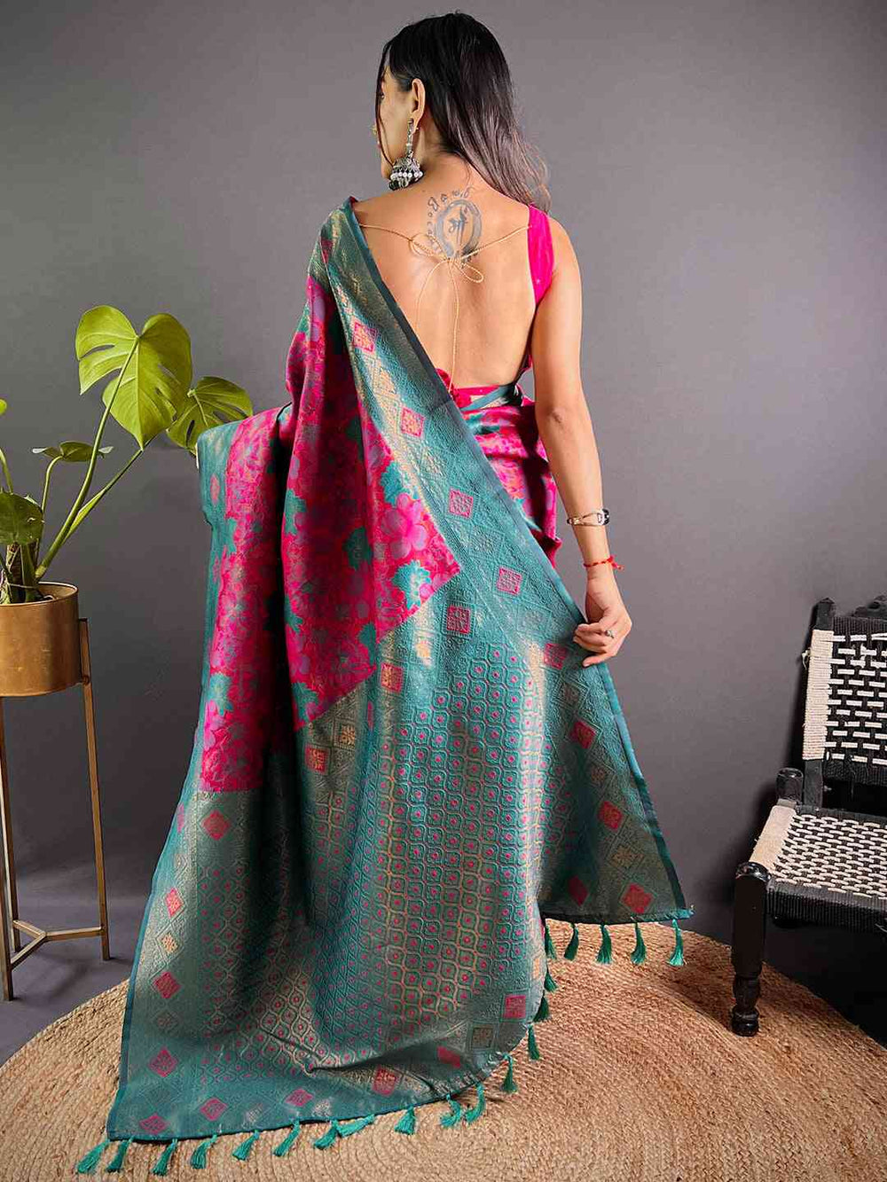 Back view of deep pink silk saree with floral patterns