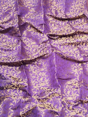 Close-up of purple brocade zari blouse fabric design