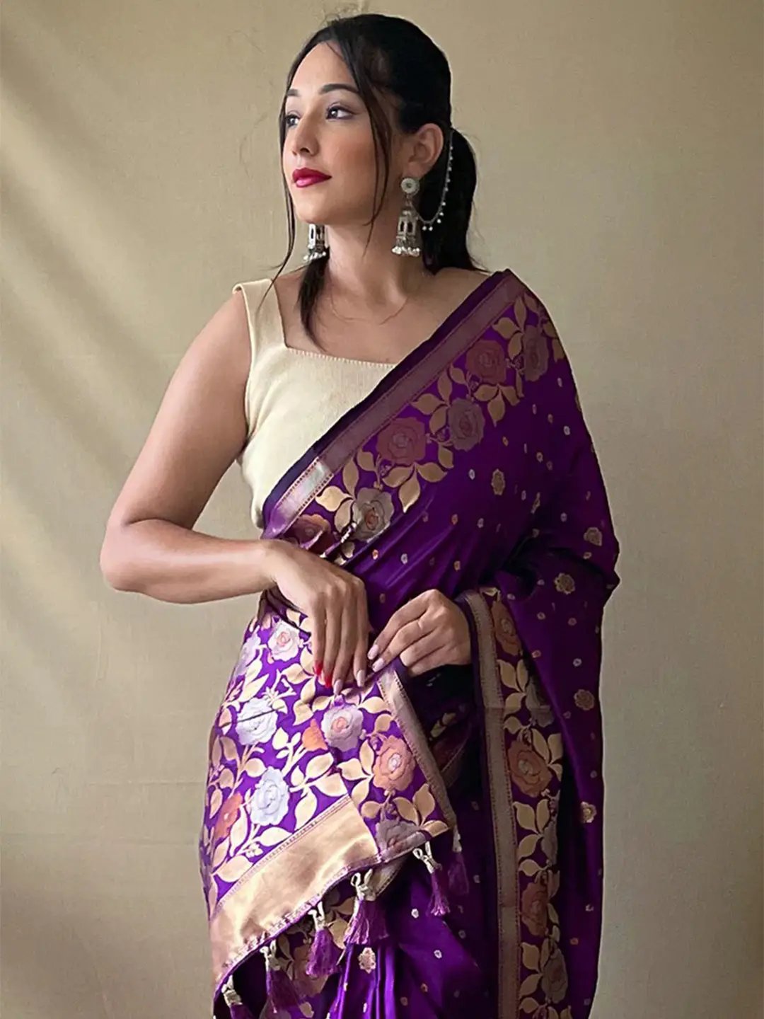 Model wearing purple Banarasi silk saree with zari work