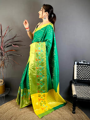 Close-up of yellow and green Banarasi saree fabric with floral motifs
