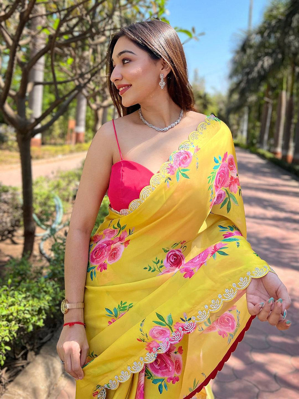 Yellow floral satin georgette saree with zircon border