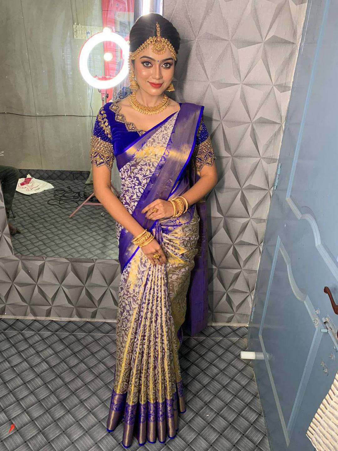 Traditional Royal Blue Gold Tissue Silk Saree with silver motifs.