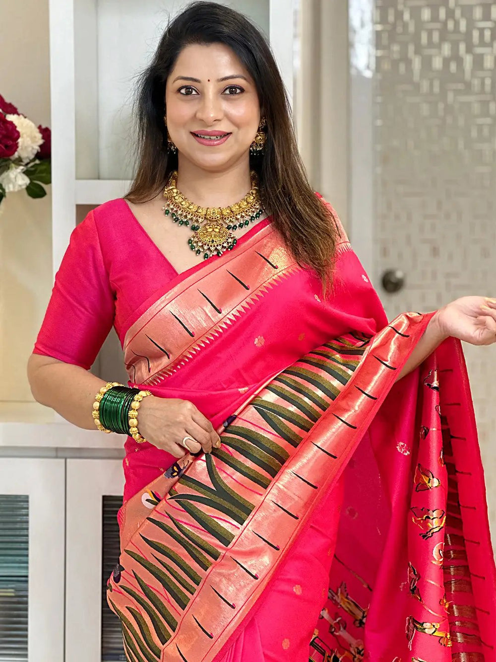 Pink Paithani silk saree with tassels, elegant design