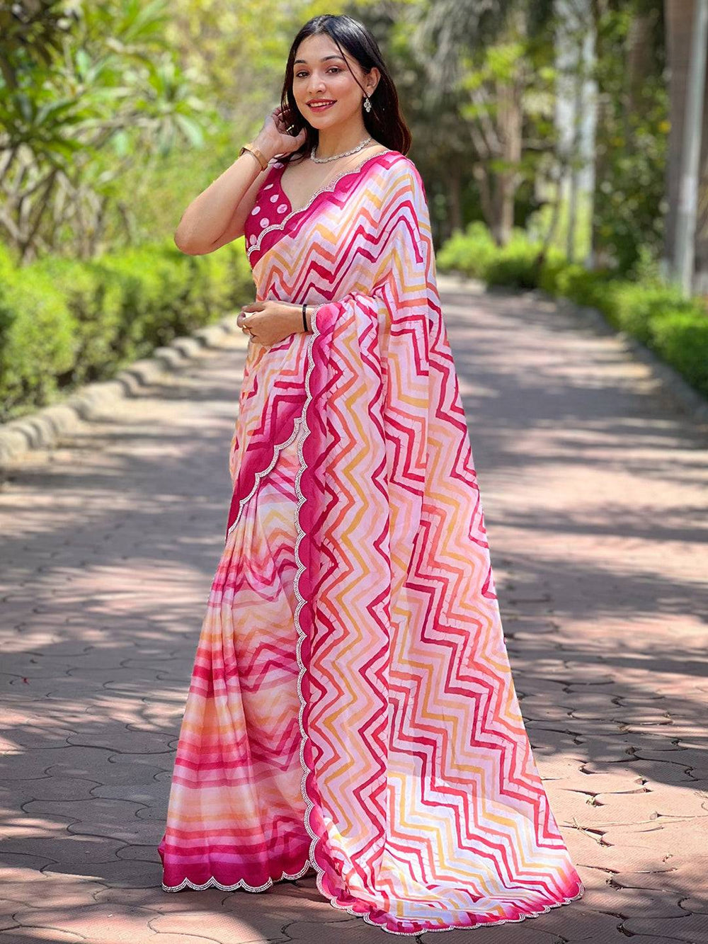Leheriya saree with striped pattern, woman posing outdoors