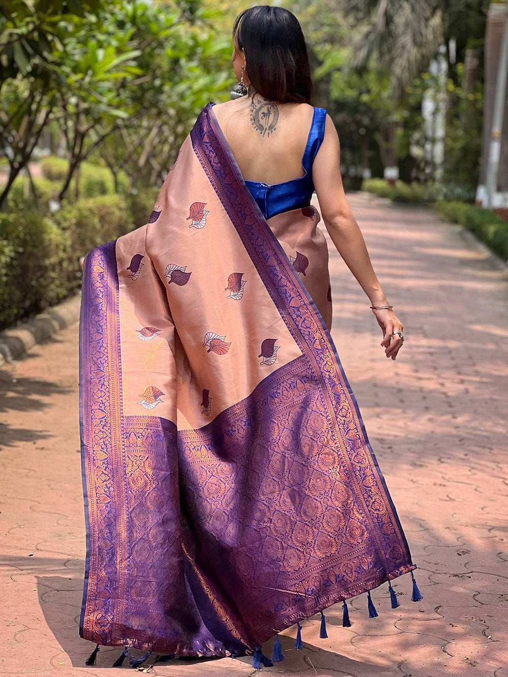 Back view of pastel peach saree with purple border design