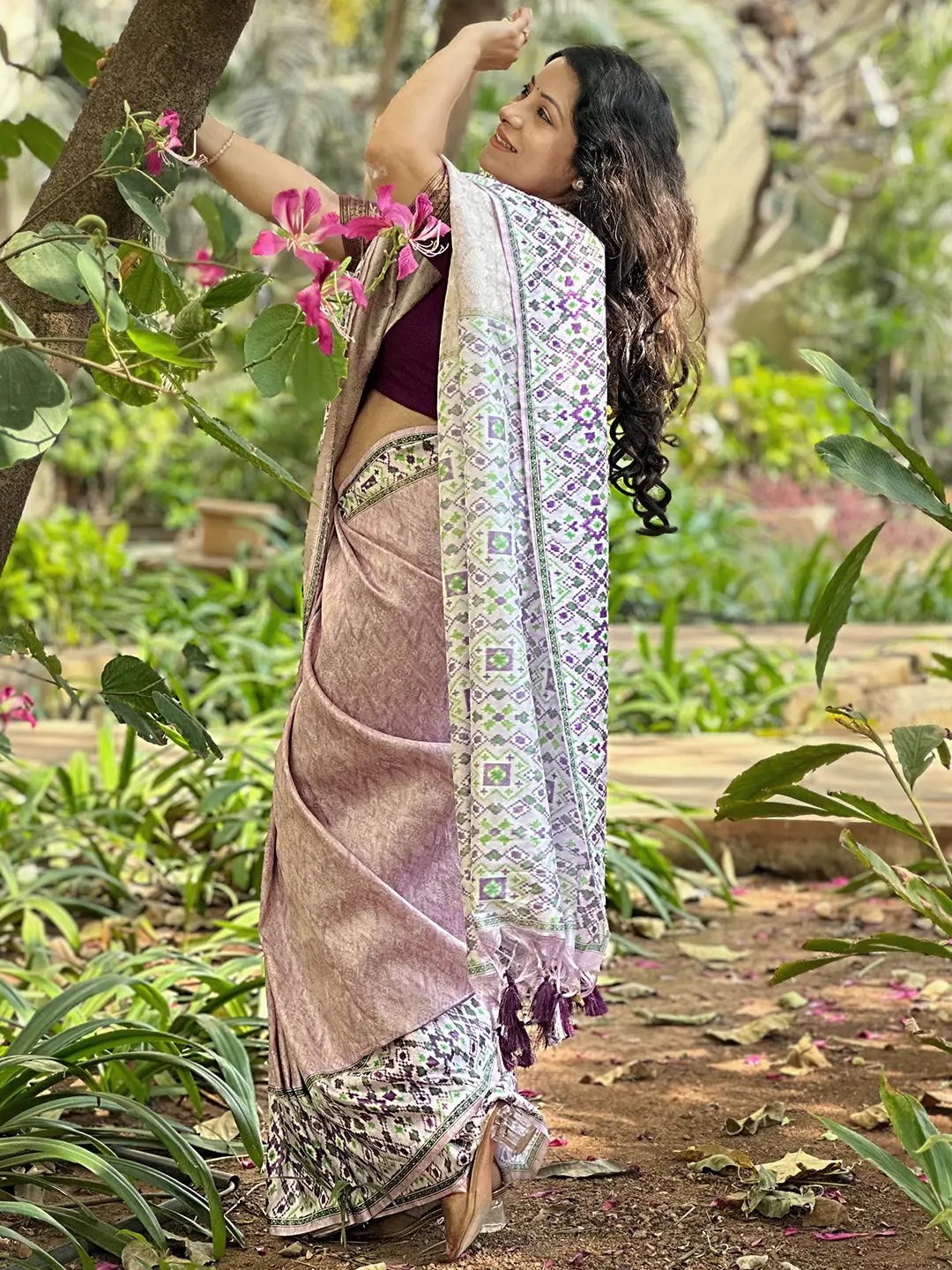 Back view of pink Patola print Kanjivaram saree in nature