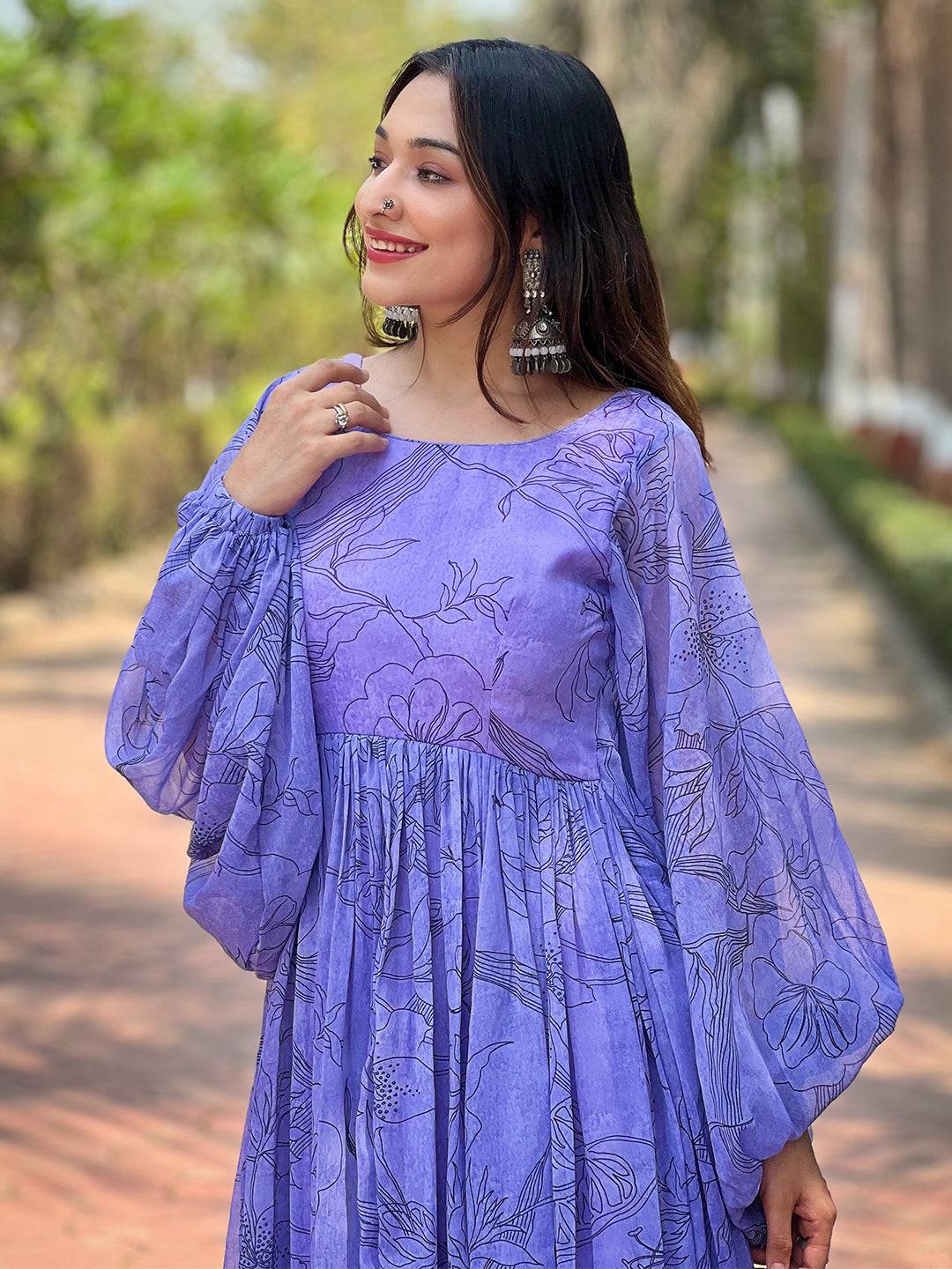 Close-up of slate blue dress with floral pattern