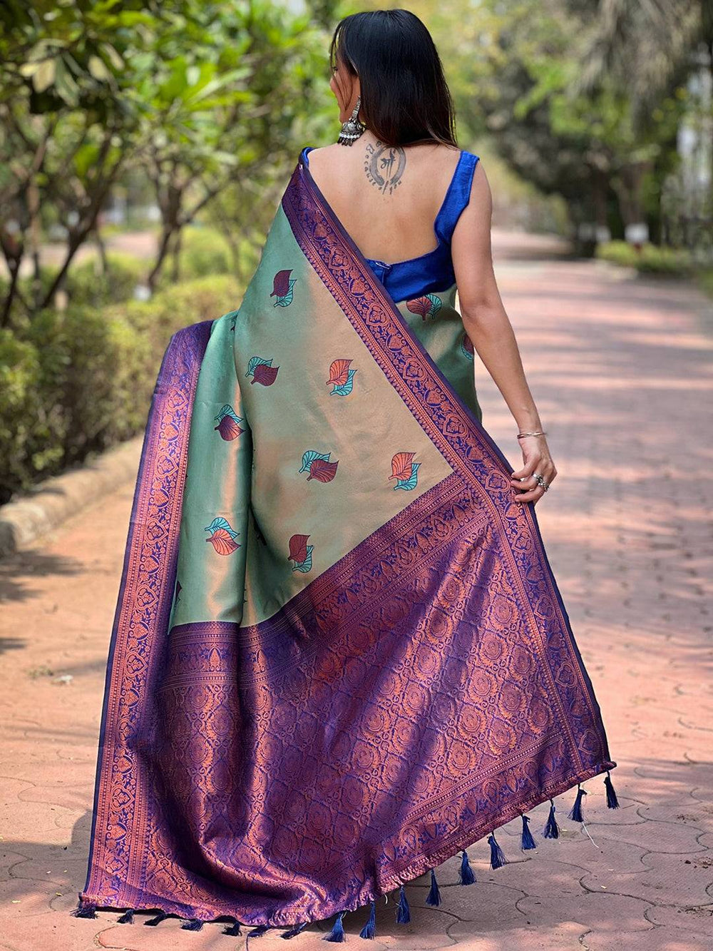 Back view of pista Kanjivaram saree showcasing detailed gold zari.