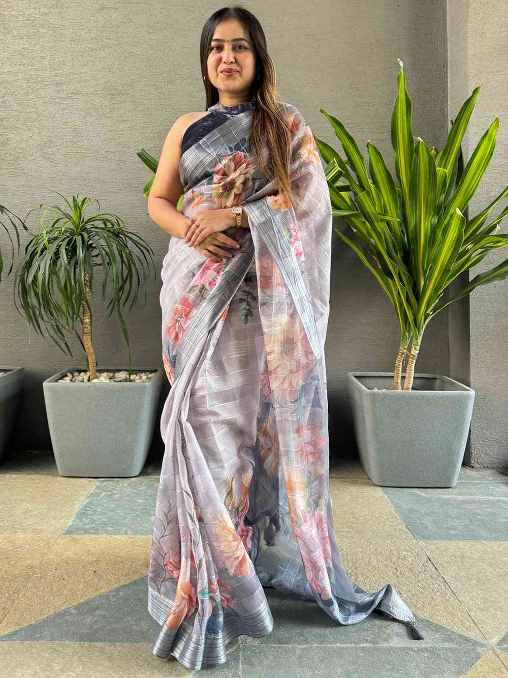 Grey saree with floral design and self zari chex weaving