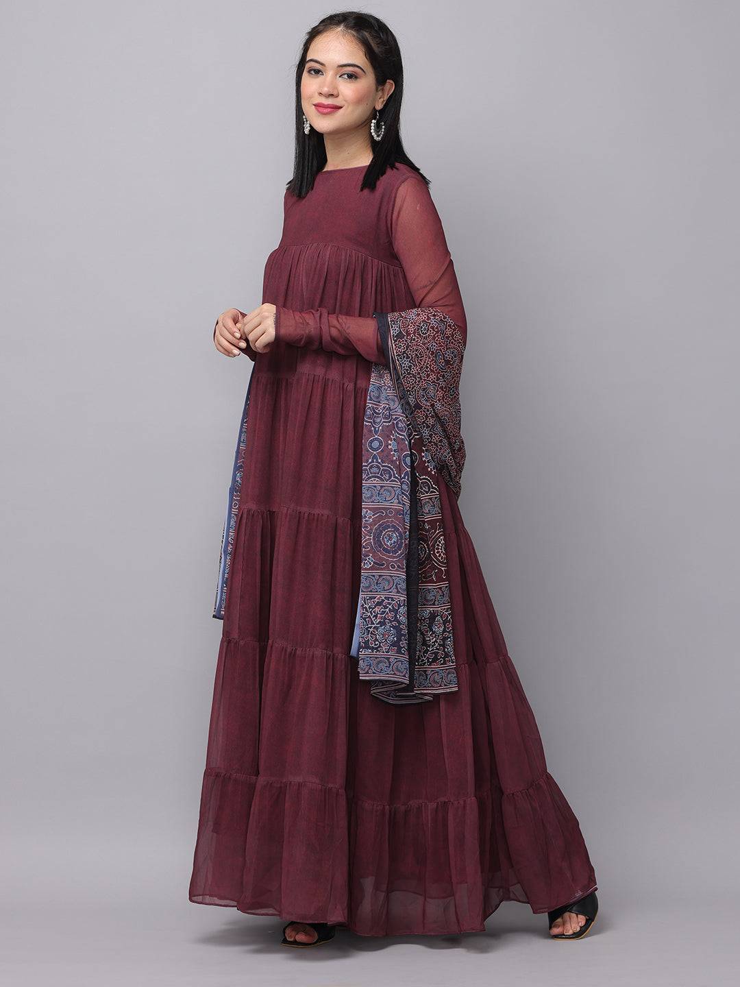Side view of mulberry dress and contrasting floral dupatta