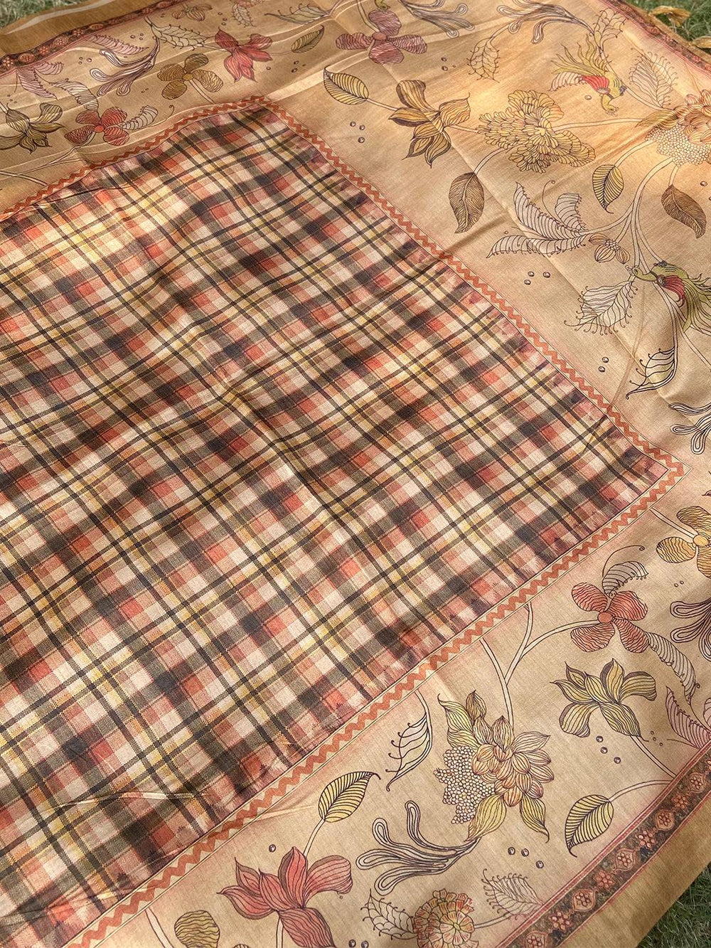 Traditional olive saree featuring Kalamkari and chex designs