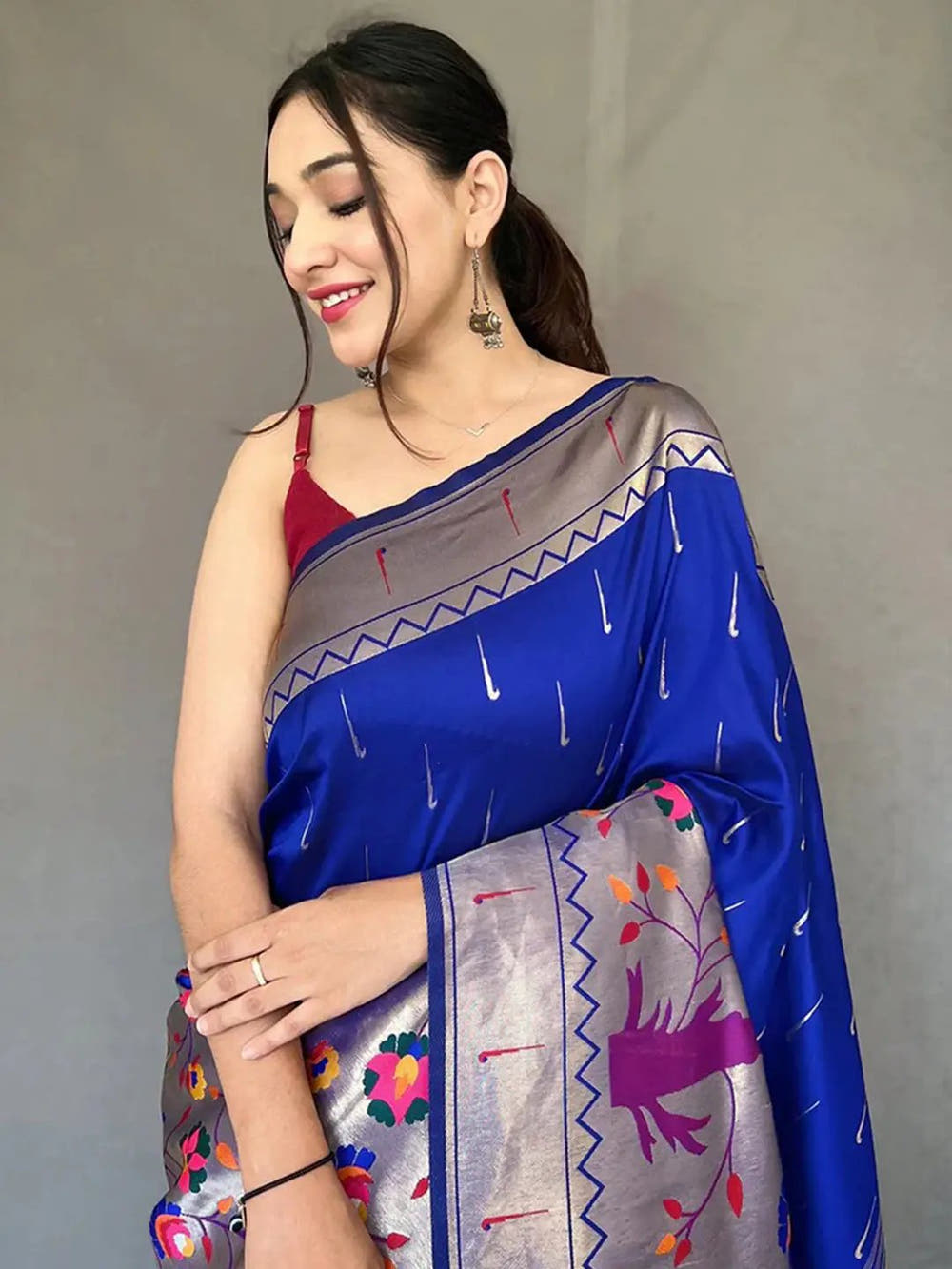 Close-up of royal blue Paithani saree with intricate details