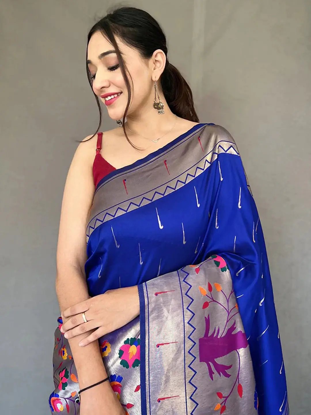 Close-up of royal blue Paithani saree with intricate details