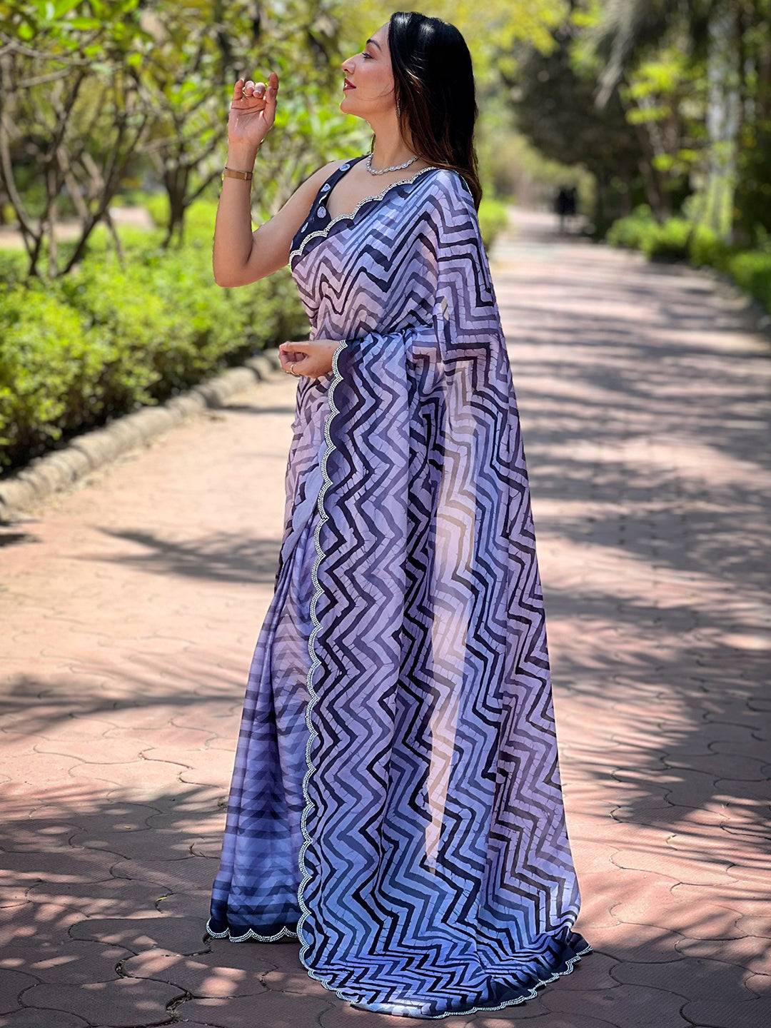Woman posing with Leheriya and striped print saree outdoors