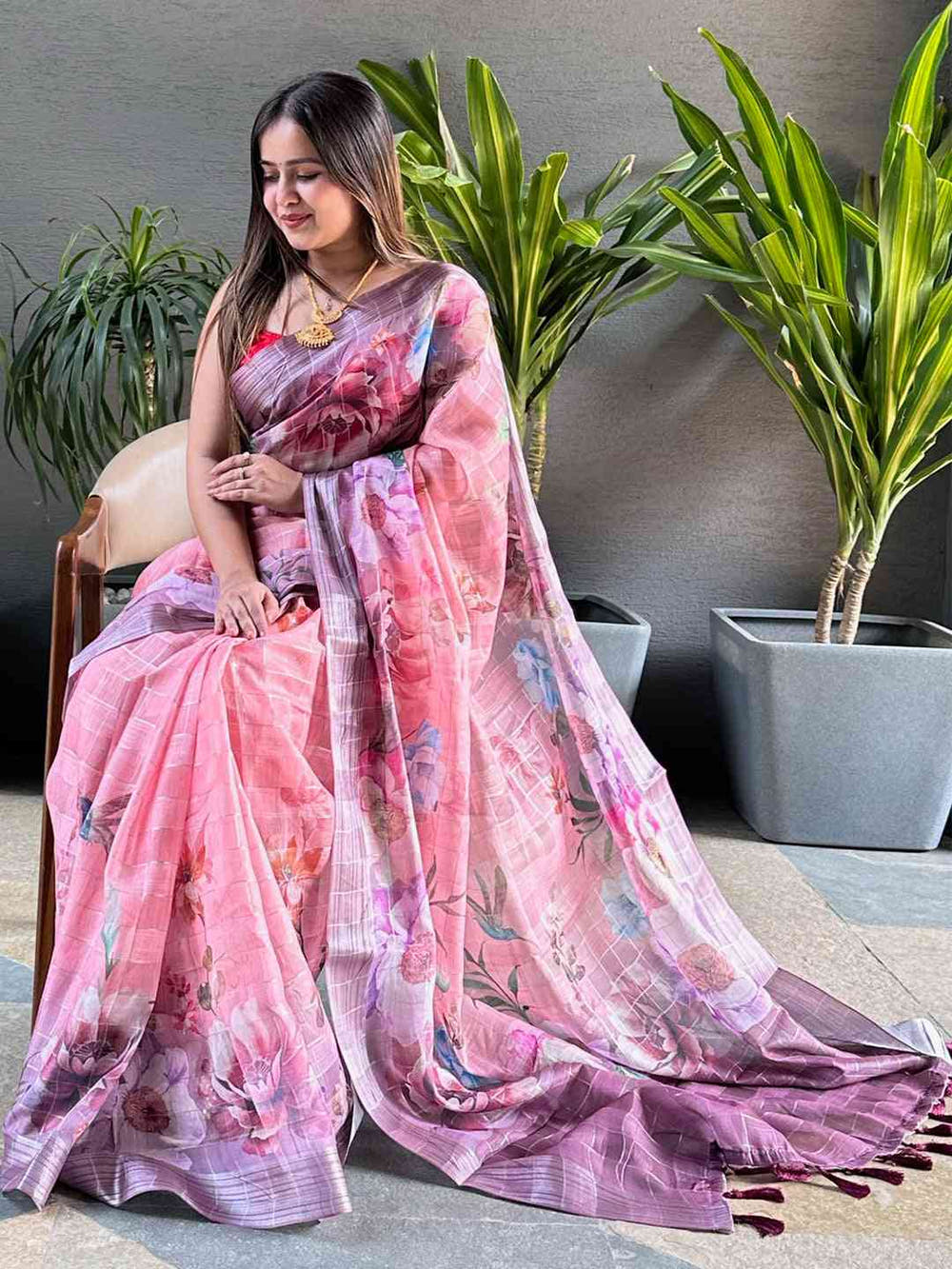 Beautiful linen saree featuring floral print and zari chex