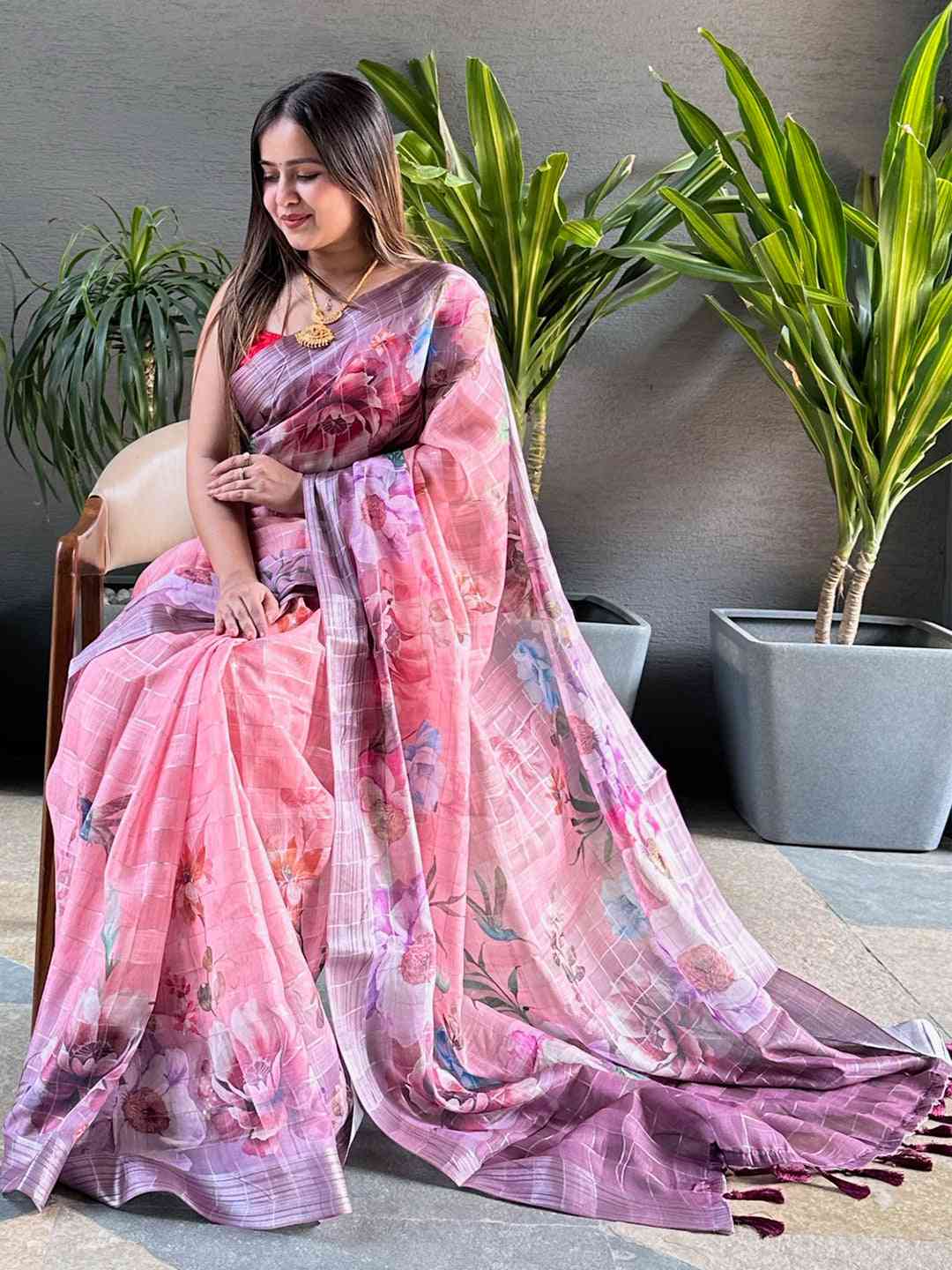 Beautiful linen saree featuring floral print and zari chex