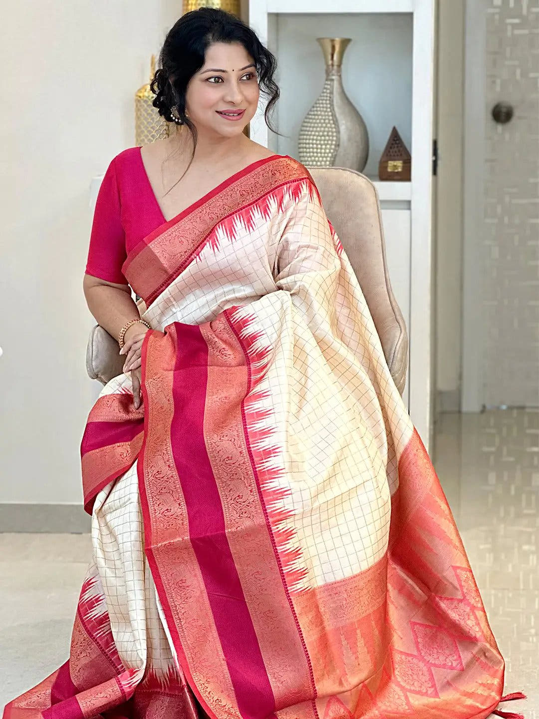 White Gadwal Pattu Saree draped elegantly with red accents