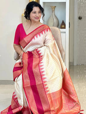 White Gadwal Pattu Saree draped elegantly with red accents